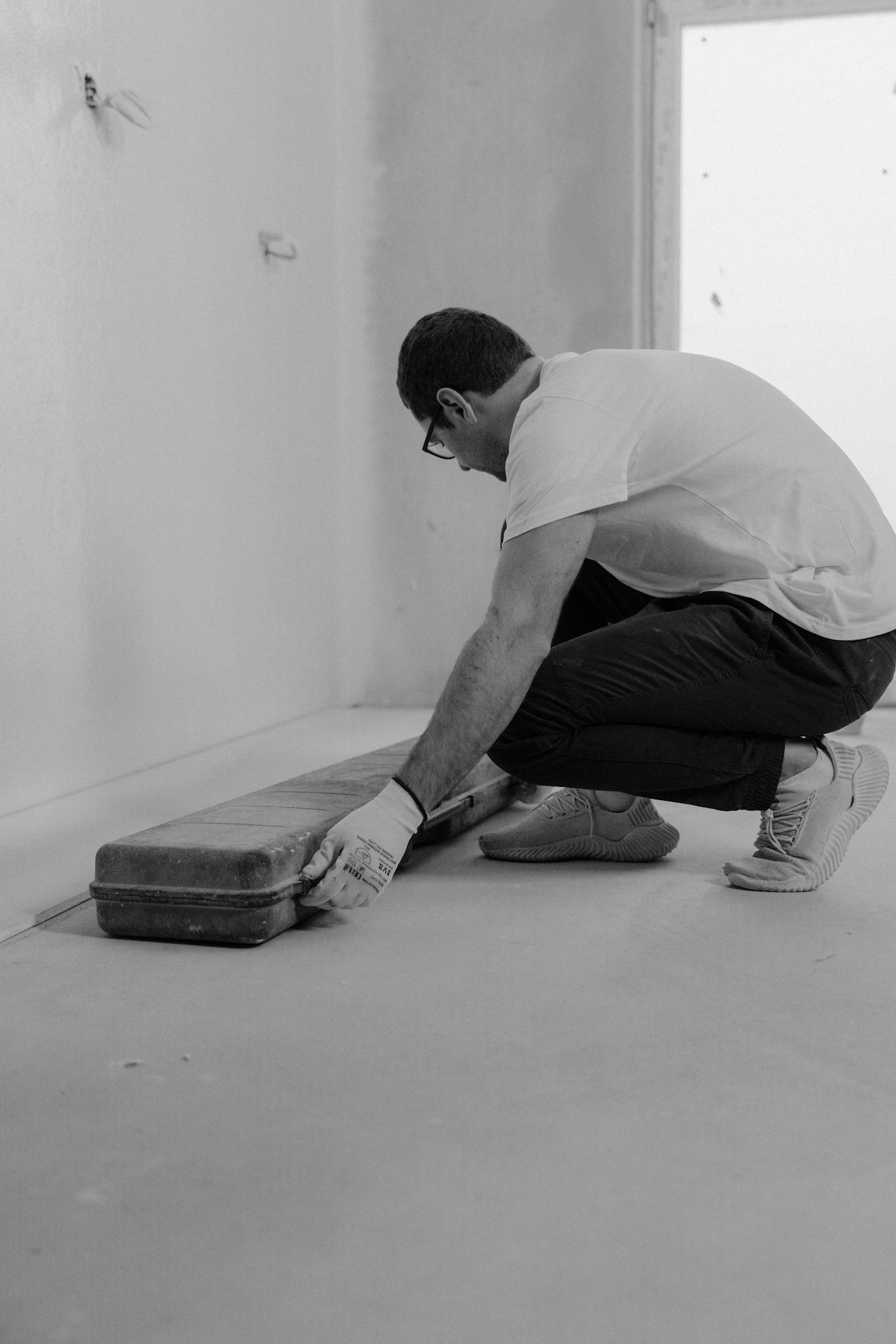 A man engaged in house renovation, focusing on improvement work.